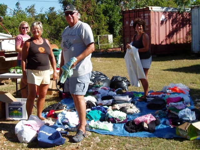 Many many days of sorting has to happen before the yard sale This photo shows people participating in one of our yard sales