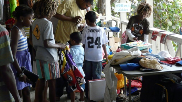 The kiks like the toys area This photo shows people participating in one of our yard sales