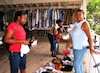 Shoppers at the Yard Sale check out items for sale