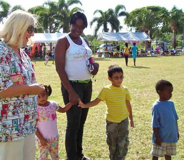 A photo shows Suzie with a mother and three children
